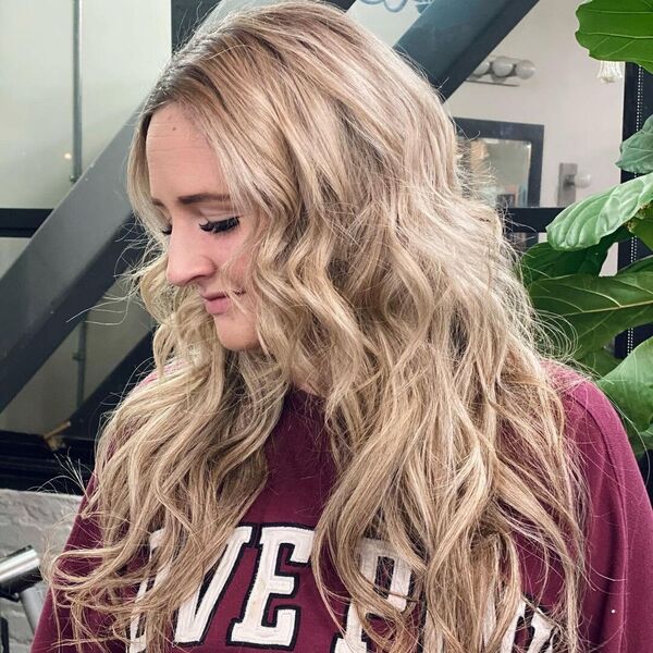 22 Braided Weave - A woman wearing a maroon sweater