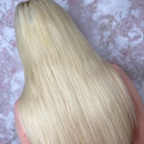 Blonde Invisible Weave - A woman wearing a pink long sleeve