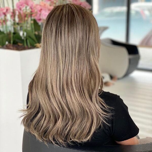 Highlights and Weave - A woman wearing a black shirt