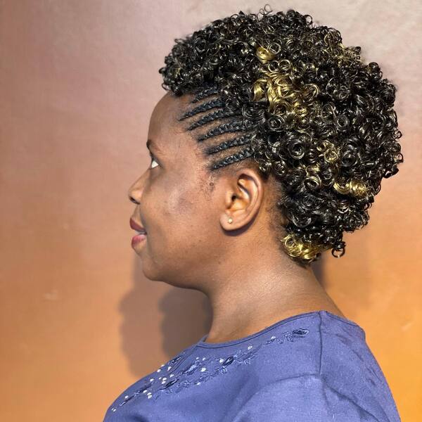 Short Curly Hairstyle - A woman wearing a purple blouse