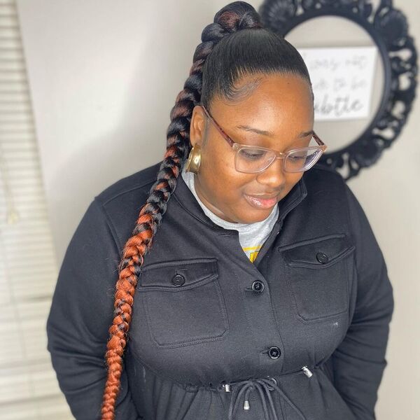 Sleek Mid Ombre Braid Ponytail - A woman with eyeglasses wearing a black coat jacket