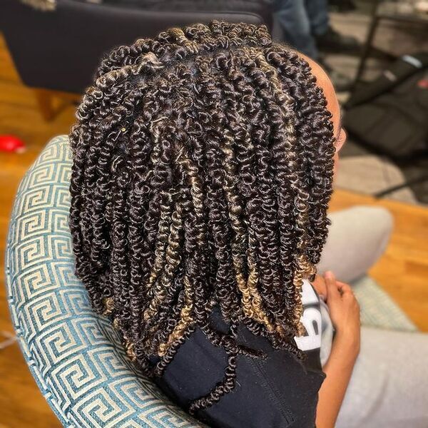 Spring Twist Braid - A woman wearing a black top