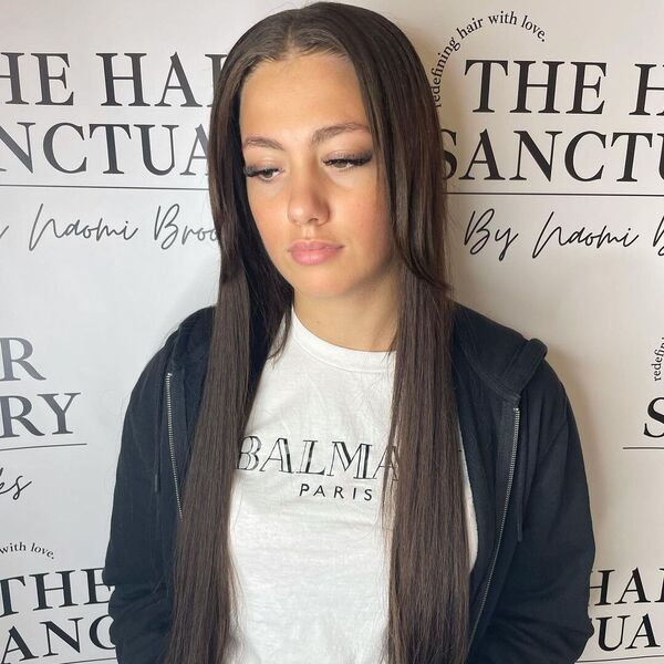 Weave with a Natural Leave Out - A woman wearing a crop top and black jacket