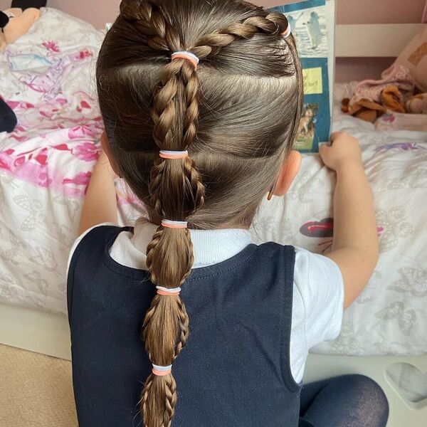 Classic Hairdo with Dutch Braid - A woman reading a book