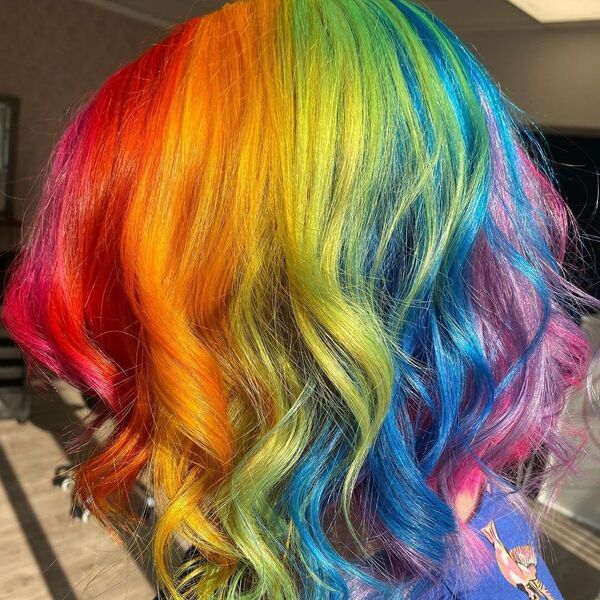 Collarbone Length and Wavy Hair - A woman wearing a blue printed blouse