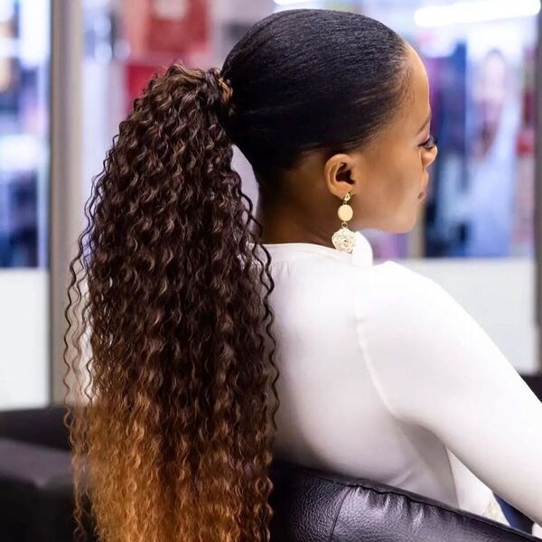 Curly Drawstring Ponytail - A woman inside a salon