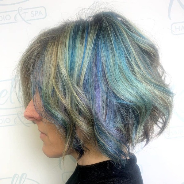 Funky Yet Classy Rainbow Hair Color - A woman wearing a black shirt