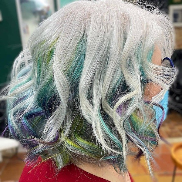 Rainbow Haired Warrior - A woman with eyeglasses wearing a red blouse
