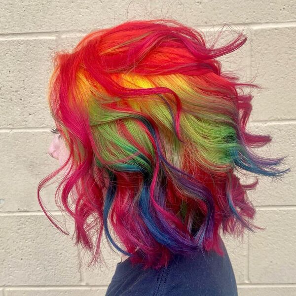 Short Wavy Rainbow Hair - A woman wearing a blue shirt