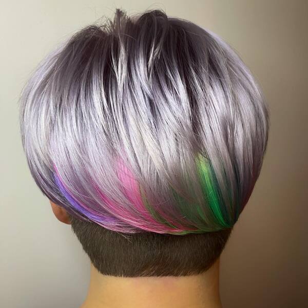 Under Cut Rainbow and Unicorn Hair Color - A woman wearing a red floral blouse